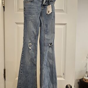 Subdued Blue Distressed Women Jeans